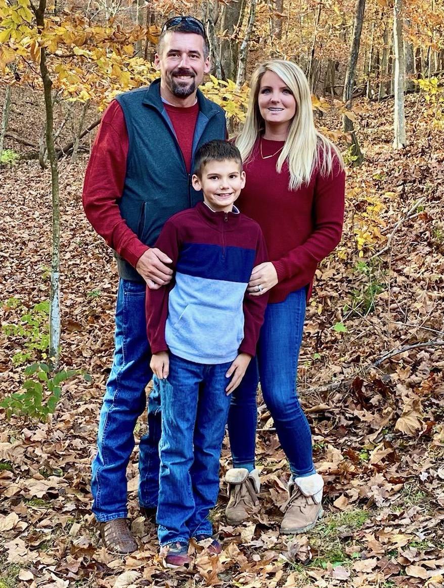 CFO Kristine Muller with her husband and son in the autumn leaves
